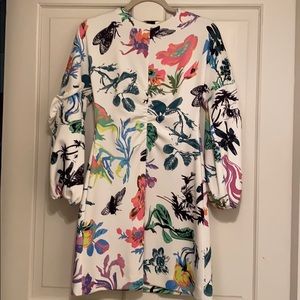 Toni floral dress with open back.